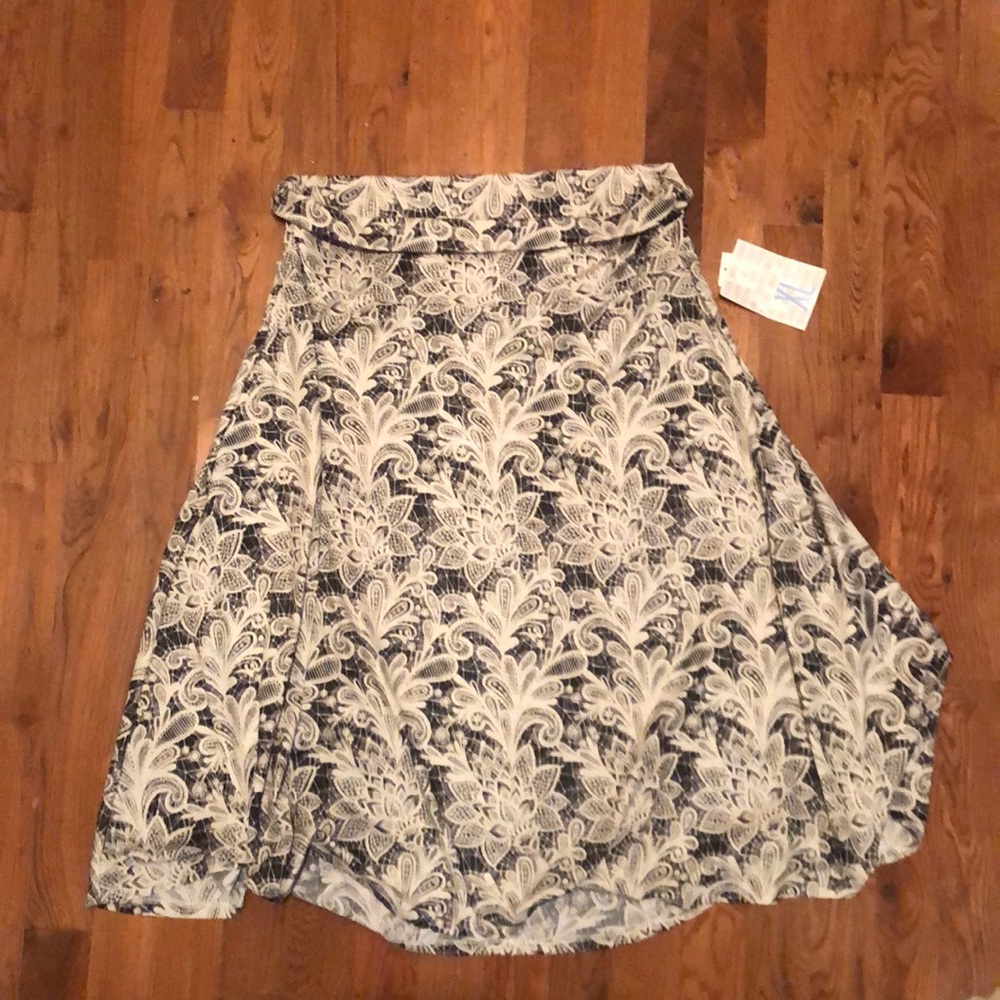 Beautiful skirt.  Pattern looks like lace.